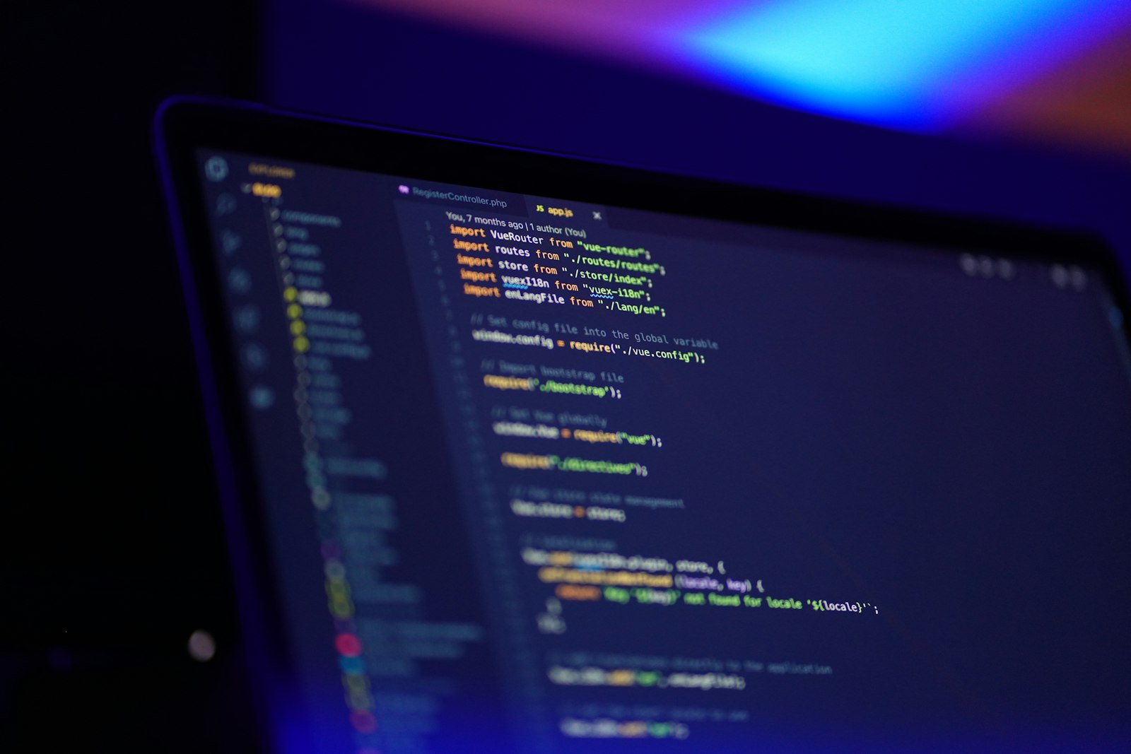 Lines of source code lit in cool blue on a screen