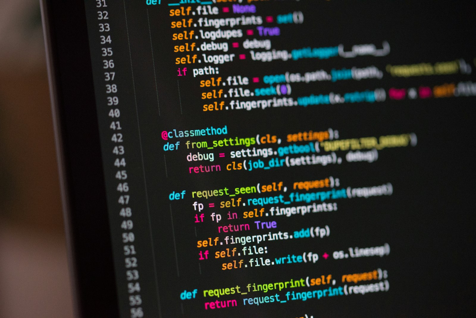 A laptop screen showing source code