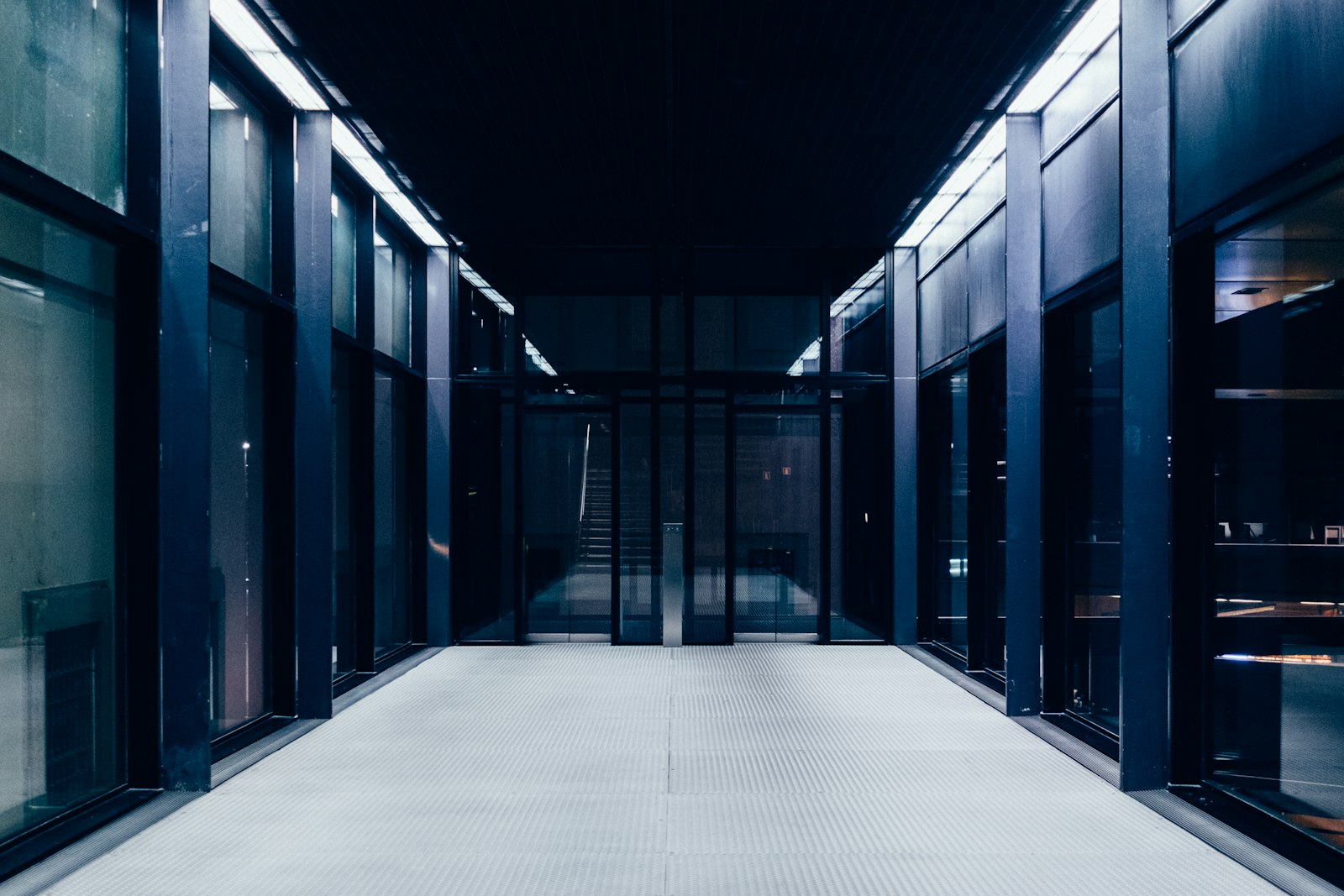 A corridor of server racks in a data centre