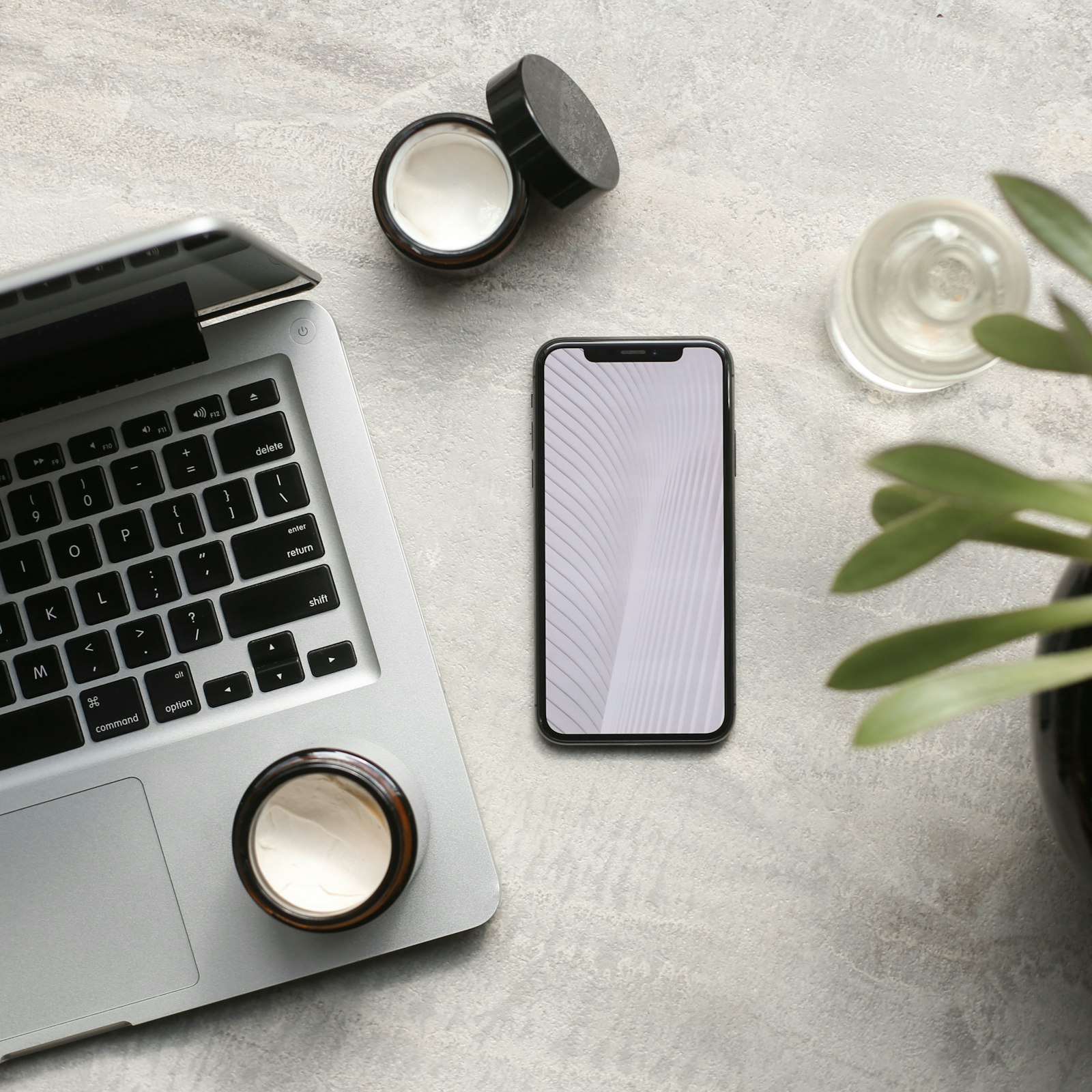 A phone held in one hand running a mobile app