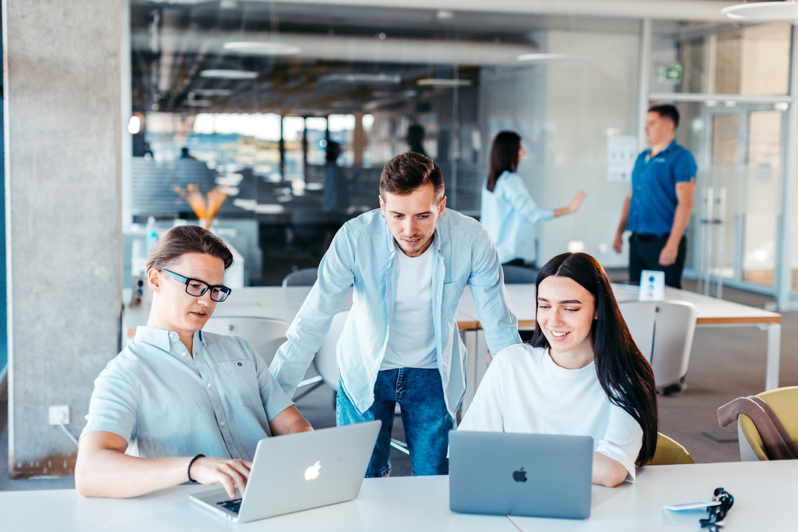 A procurement team working together in an office